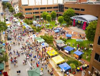 A birds eye view of a street festival with vendor tents in downtown Lancaster