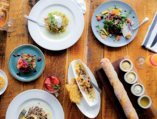 Birds eye view of plates of food set on a table