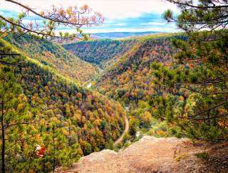 Landscape view looking out over a river gorge with fall foliage