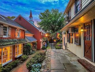 A quaint outdoor shopping center at dusk