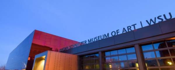 Outside view of the Jordan Shnitzer Museum of Art, also known as the Crimson Cube for its red reflective glass exterior.