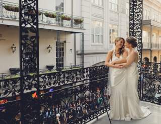 LGBT brides on balcony