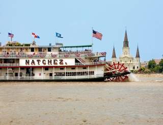 On this Sunday brunch cruise, travel along the Mississippi River while enjoying live jazz music and savoring a lovely buffet brunch, if option selected. Otherwise, sit inside in one of our elegantly appointed decks or sit outside on one of our outdoor decks and enjoy the sites and breezes of the Mississippi River. This authentic paddle-wheel riverboat will whisk you away to the romance and ambiance of yesteryear. The Steamboat NATCHEZ is taking some time off, but her sister vessel, the Riverboat CITY of NEW ORLEANS will be taking her place. You’ll get the same authentic riverboat experience of a leisurely, two-hour cruise on the mighty Mississippi, enjoying traditional live jazz, craft cocktails, and all the beautiful New Orleans sites, while also exploring the newly renovated riverboat. Make sure you check out all four decks - the top deck view is a sight to see! Upgrade your ticket to include the brunch buffet.