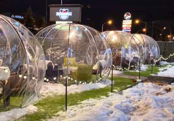 Staying cozy in an igloo while dining at Matanuska Brewery in Anchorage, Alaska.