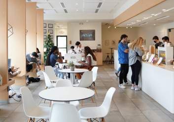 Customers enjoying the atmosphere and ordering drinks at Blendin Coffee Club.