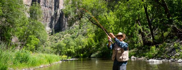 An angler enjoys fishing in the Gila River.
