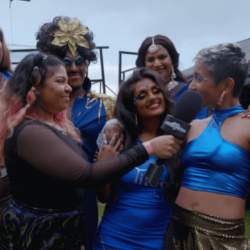 A group of people wearing shiny blue outfits
