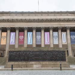 St George's Hall in Liverpool with a large Taylor Swift banner on the front of the building.