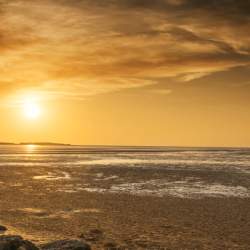 A sunset on a beach in Wirral