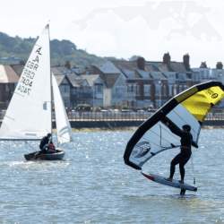 2 sail boats out on the water