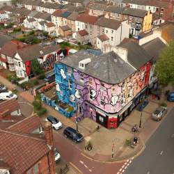 Drone view of a building in New Brighton with street art