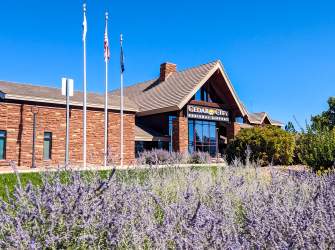 The Cedar City Regional Airport with a spot of bright purple flowers in front.