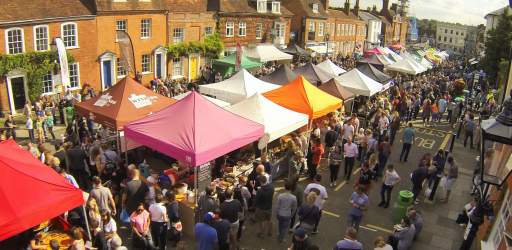 Market stalls with people at Farnham Food Festival