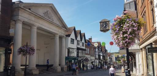 Guildford High Street with clock and Tunsgate Arch