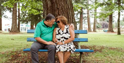 elderly couple on a park bench