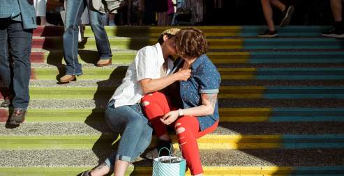 couple kissing on steps