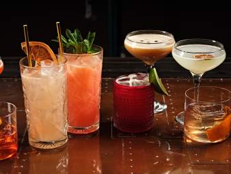 Various cocktails are lined up on a table at El Jefe at Saguaro in Palm Springs.
