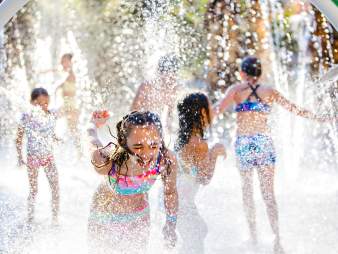 Children play in a splash pad at Hyatt Regency Indian Wells Resort & Spa.