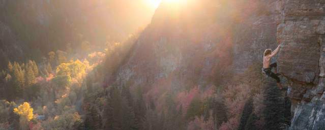 Man Rock Climbing American Fork Canyon during the fall time