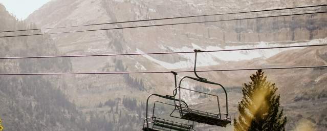 Chair lifts with mountains in the background
