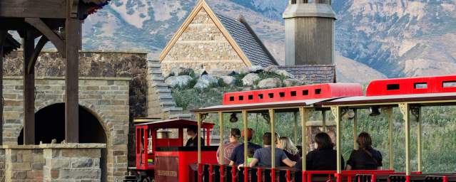 Evermore Park red Train ride with mountains in the background
