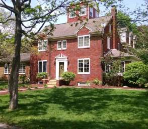 Exterior of traditional brick colonial home in Manchester, MI