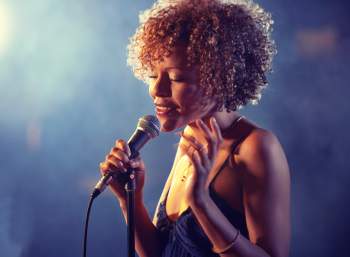 Black female Singer Performing on stage