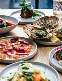 Selection of small plates on a table at Bristol Lido