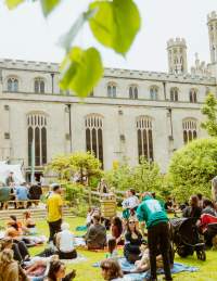 Trinity Garden Party Bristol with people sat on the grass - credit Trinity Bristol