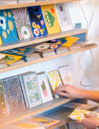 Person browsing at Fig 1 shop in Wapping Wharf - Credit Hey What