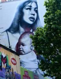 Various pieces of street art on the side of buildings in Nelson Street, central Bristol - credit Blackbeard to Banksy Bristol Walking Tour