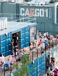 An aerial view of people dining alfresco at Wapping Wharf on Bristol's Harbourside - credit Jon Craig