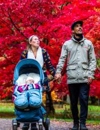 A family walking through the grounds of Westonbirt Arboretum near Bristol in autumn - credit Johnny Hathaway