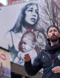 One of the guides from the 'Where The Wall' street art tour in Nelson Street, central Bristol - credit Paul Box