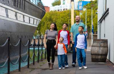 A family exploring the exterior of the SS Great Britain in the Great Western Dockyard, Bristol - credit Brunel's SS Great Britain