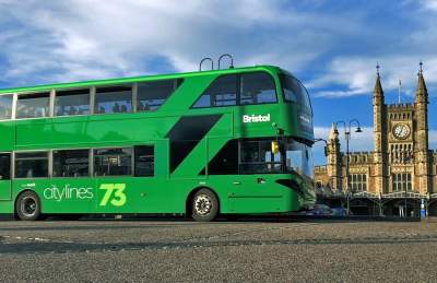 A green City Lines bus infront of Bristol Temple Meads - Credit First Bus