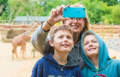 Family with giraffes at Bristol Zoo Project - credit Bristol Zoo Project