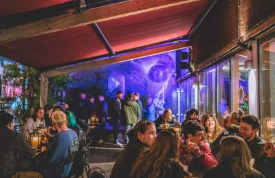 People sat on front terrace at The Canteen in Bristol at night - credit The Canteen