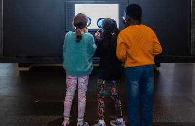 Children looking at an exhibit at the We The Curious science centre in Bristol - credit  Tom Griffiths