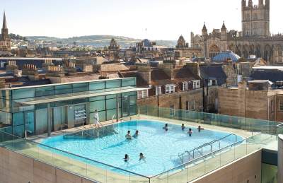 An aerial view of the rooftop pool at the Thermae Bath Spa in central Bath near Bristol, with Bath's skyline in the background