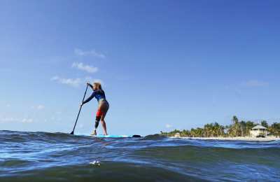 Paddleboarder with prosthetic leg navigates ocean waves in Key Biscayne