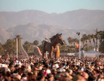 A mustang sculpture appears to float above the crowd at Stagecoach 2022.