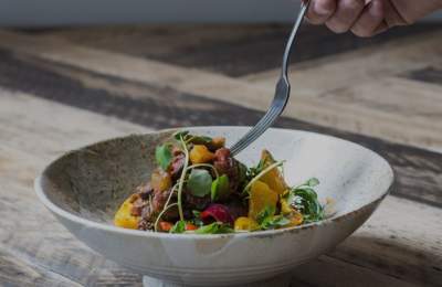 A white plate with healthy food.