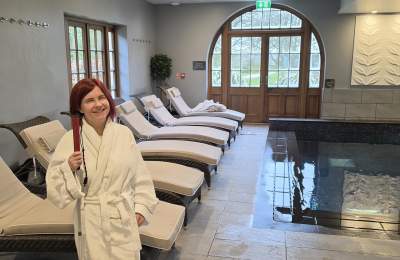 Sassy standing in the Elan Spa in a robe, at Mallory Court Hotel and Spa