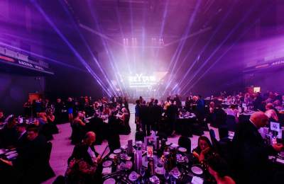 a wide angle shot of the REYTAs from 2019 showing the tables looking towards the stage and lighting