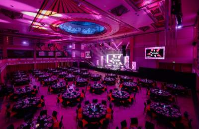 A shot of the REYTAs ceremony room, including tables, lighting and stage