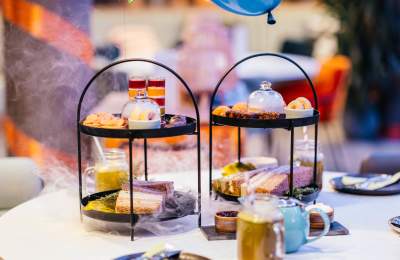 Photograph shows cake stands and drinks making up the BFG afternoon tea at Chichester Festival Theatre