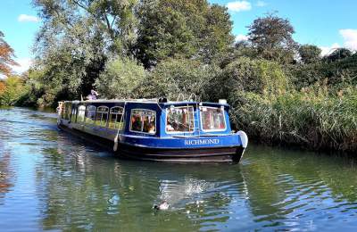 a canal boat sailing along Chichester Canal