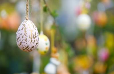 Patterned eggs hand from branches