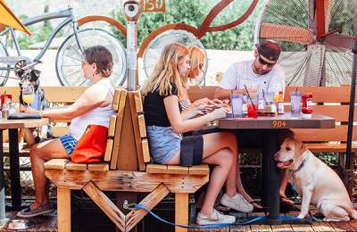 Patrons at the tables on the patio of O.H.S.O in Phoenix, AZ
